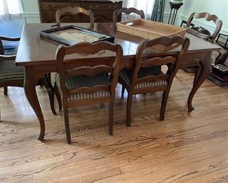 Dining table with 2 leaves (available with table pads) and 6 chairs (2 arm and 4 side)