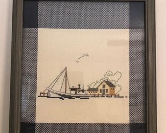 Framed nautical cross-stitch.