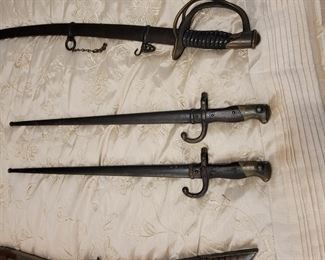 Antique 1862 Civil War Calvary sword 
Antique 1878 French Bayonets
The swords, bayonets and antique guns are not in the house until the sale.