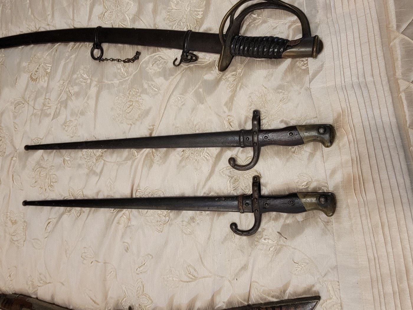 Antique 1862 Civil War Calvary sword 
Antique 1878 French Bayonets
The swords, bayonets and antique guns are not in the house until the sale.