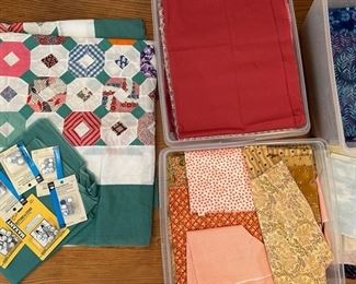 Unfinished Quilt Top With Boxes Of Fabric