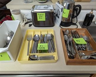 flatware, toaster, electric coffee pot, coffee grinder