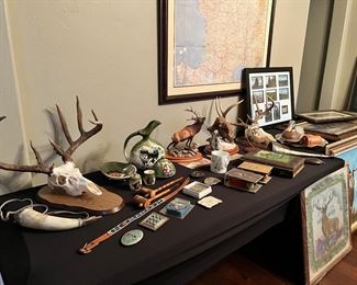 Collection of Native American art and hunting-related decor