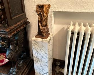 Wooden sculpture and marble pedestal