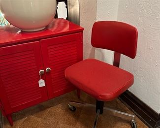 Orange cabinet and vintage office chair