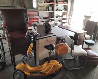 One of two vintage E-scooters, 1950's formica and chrome table
