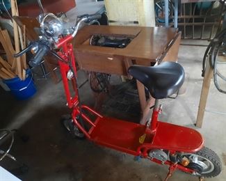 Other E-scooter and sewing machine in cabinet