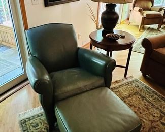 Pair of sage green American Leather chairs and ottomans