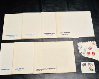 1973, 1974, 1975 and 1980 mint sets, old post cards and stamps