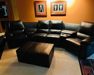 Black leather reclining sofa with storage ottoman in like-new condition