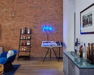 Custom Pony hair Credenza/Side board bar with built in uplights 80% off. Annie Leibowitz Signed Sumo photography book.  Leaning ladder Bookshelf. Good Vibes only custom neon light. Beatles Print