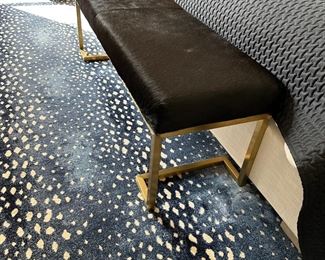 Restoration Hardware Real cowhide Bench is in Excellent condition. Thick, cushioned seat upholstered in black hair-on cowhide the Hair-on hides are natural and undyed with brush brassed base and legs.
Inherent variations in coloring, hair length and texture make each hide unique and each bench one-of-a-kind; no two benches are exactly alike.  Dimensions 54"W x 16"D x 18"H