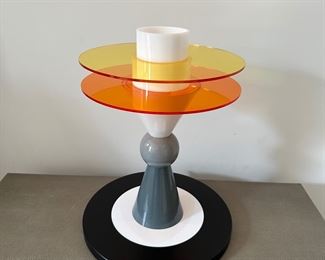 Rare Ettore Sottsass Memphis Table lamps. The Bay Table Lamp is an iconic piece originally designed in 1983 by the dynamic Ettore Sottsass and presented by Memphis Milano, 
Location, Soho NYC
Material: Glass, aluminum and plexiglass
Dimmable. 
Great condition"
H 19.69"  DIA 15.75"
Lamps are a historically sensational creative entity that made its mark on the art and design world in the 80s and beyond. Composed of glass, metal, and perspex, the silhouette is playful and artfully composed.
Founded in 1980, Memphis Milano, also known as Memphis Group, was a collective of designers founded by Ettore Sottsass. Operating until 1988, Memphis Milano focused on postmodern design with furniture that was often colorful, abstract and featured asymmetrical shapes.
Lighting Style: Soft/Diffused/Ambient
