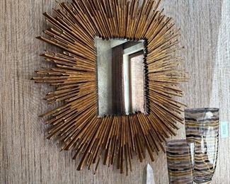 Gold Leaf - Soleil Mirror
Retails $2,800 selling for $900 or best offer 
Dimensions 41.5"W x 45"H x 2"D (23.1 lbs)
Reflective area 14.5"W x 18.5"H
Hangs by a 18" metal wall cleat horizontally/vertically that is provided
Acacia Wood/ Gold Leaf
“Inspired by the Baroque depictions of the saints' halos found in churches throughout Europe” 