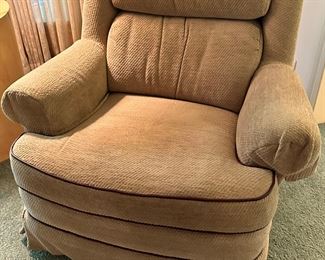Disque Furniture Rock and Swivel Club Chair (there are 2 of these).  Sand with dark brown piping, kick pleat skirt.