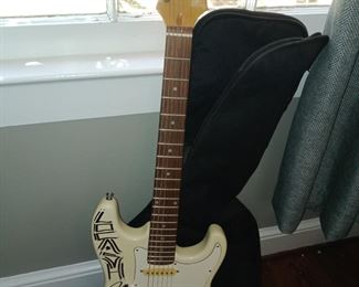 Electric guitar signed by Lo Cash