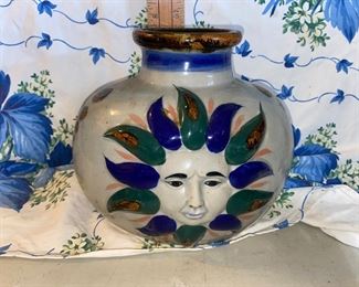 7.5 inches Tall Pottery Sun Face with Birds on other side $10.00