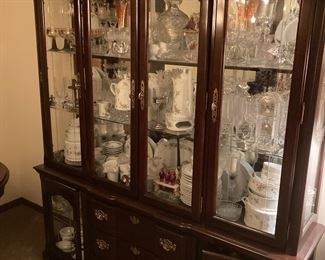Dining room hutch filled with European glassware and crystal