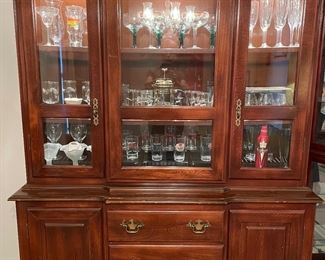 Matching china hutch, it lights up, lots of collectable vintage glassware and some beer glasses