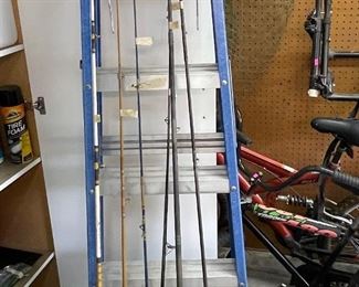 Ladder and fishing rods some have reels