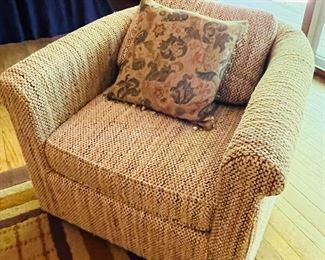 A pair of1970s tweed barrel chairs. 