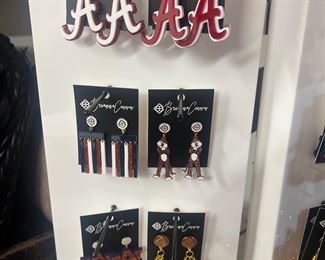 Store inventory of Alabama and Auburn jewelry , purse straps and more.