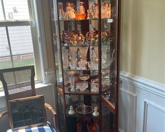 Corner lighted curio cabinet filled with Crystal, lalique Crystal figurines, Hummel, and more 