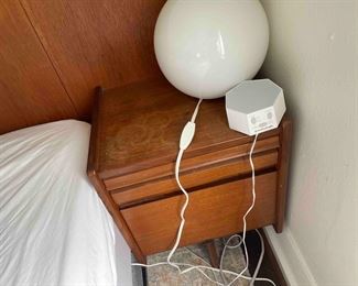 lamp, white noise machine, bed and bedframe