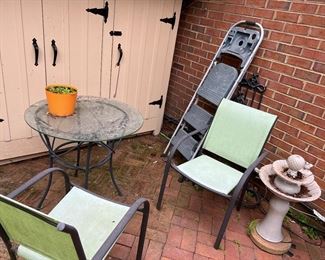 Outdoor furniture, step ladder, and fountain 