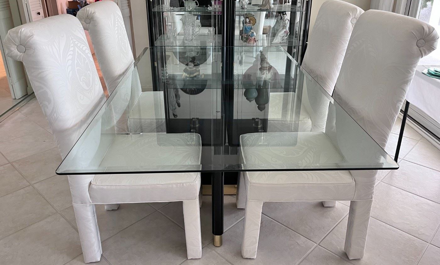 80's glass top table on black pedestal; 4 reupolstered chairs.