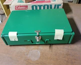 Vintage Coleman Stove c. 1970s still has packaging tape intact.