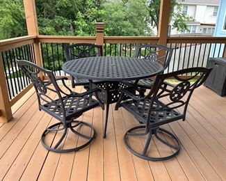 Outdoor table, 4 chairs, swivel rockers