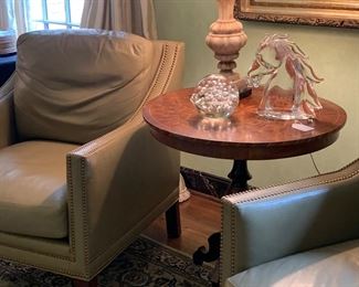 Pair of taupe leather club chairs with nailhead trim