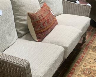 Summer Classics woven wicker resin sofa, Kilim pillow