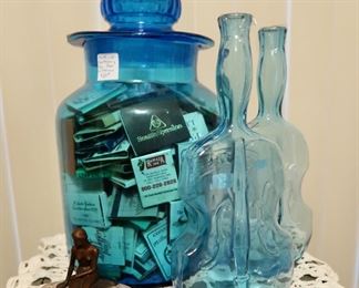 Blue Canister full of vintage matches.  Also, Lady of Salado piece