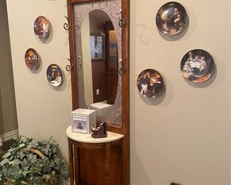 Hall tree with marble top and frosted mirror. Also a collection of Norman Rockwall plates. 