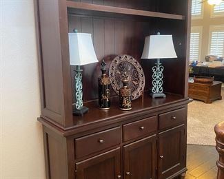 Love this cabinet. There is a shelf that fits in the center if you want to use as a display or book shelf or you have room for a tv with the shelf removed. 