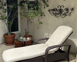 All weather wicker chaise lounge, iron/glass accent table, potted plants