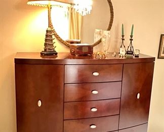 Parcel gilt mirror, bow front dresser