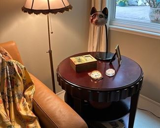 Cozy reading nook, leather sleeper sofa, 3-tier table, reading lamp