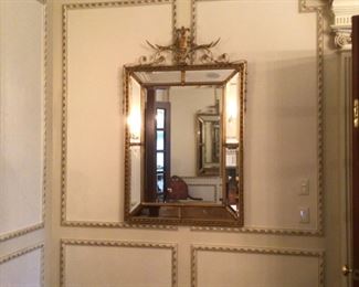 One of a pair of gilt mirrors