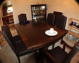 Dining table and six chairs; 68" as shown, plus a 23" leaf