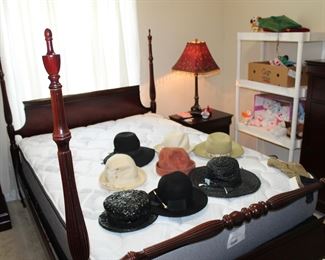 antique four-poster bed, like-new mattress