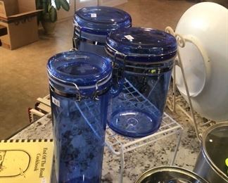 3 blue glass storage jars