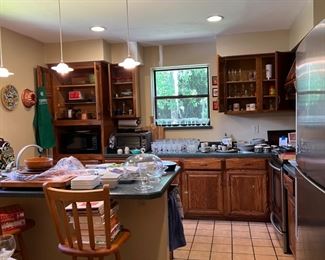 Kitchen  pots, pans, dishes, utensils, barstools 