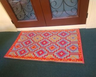 2 matching rugs same size & colors