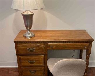 Desk with lamp and chair