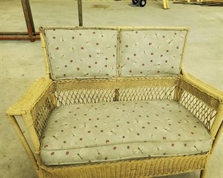 Three pieces to the porch set.  Rare to see a wicker loveseat with headboard.  Come and get it!