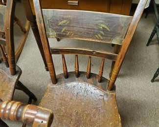 One of Six Chairs - Sturdy  . The seats are very thick and the backs of the chairs fan outward.  