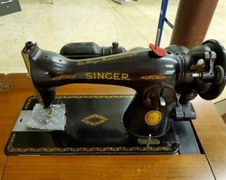 Beautiful Cabinet and Attachments with the Sewing Machine.